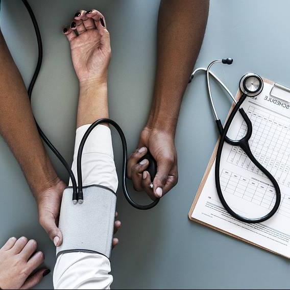 A person having their blood pressure measured