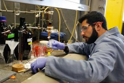 student working with lab equipment