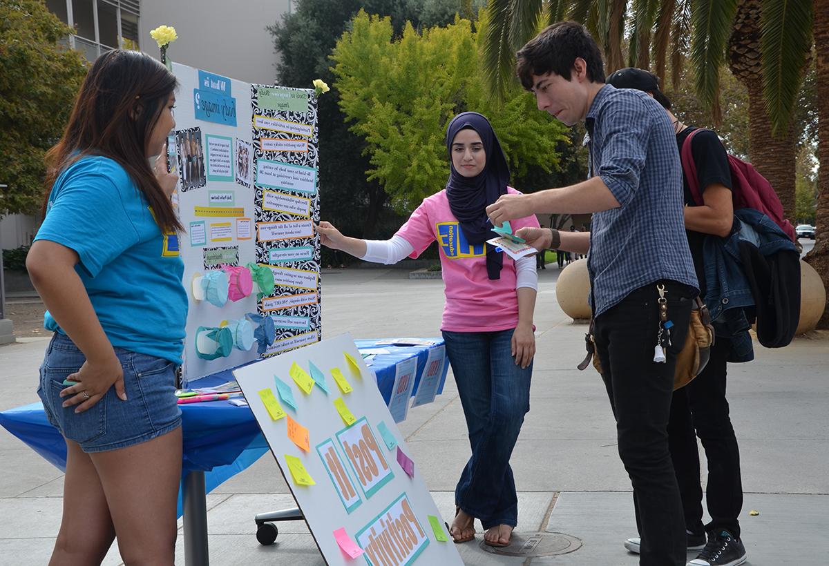 Post It Positivity tabling on 7th street.