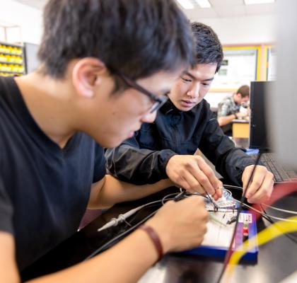 Intellectual Wellness - Two students testing computer